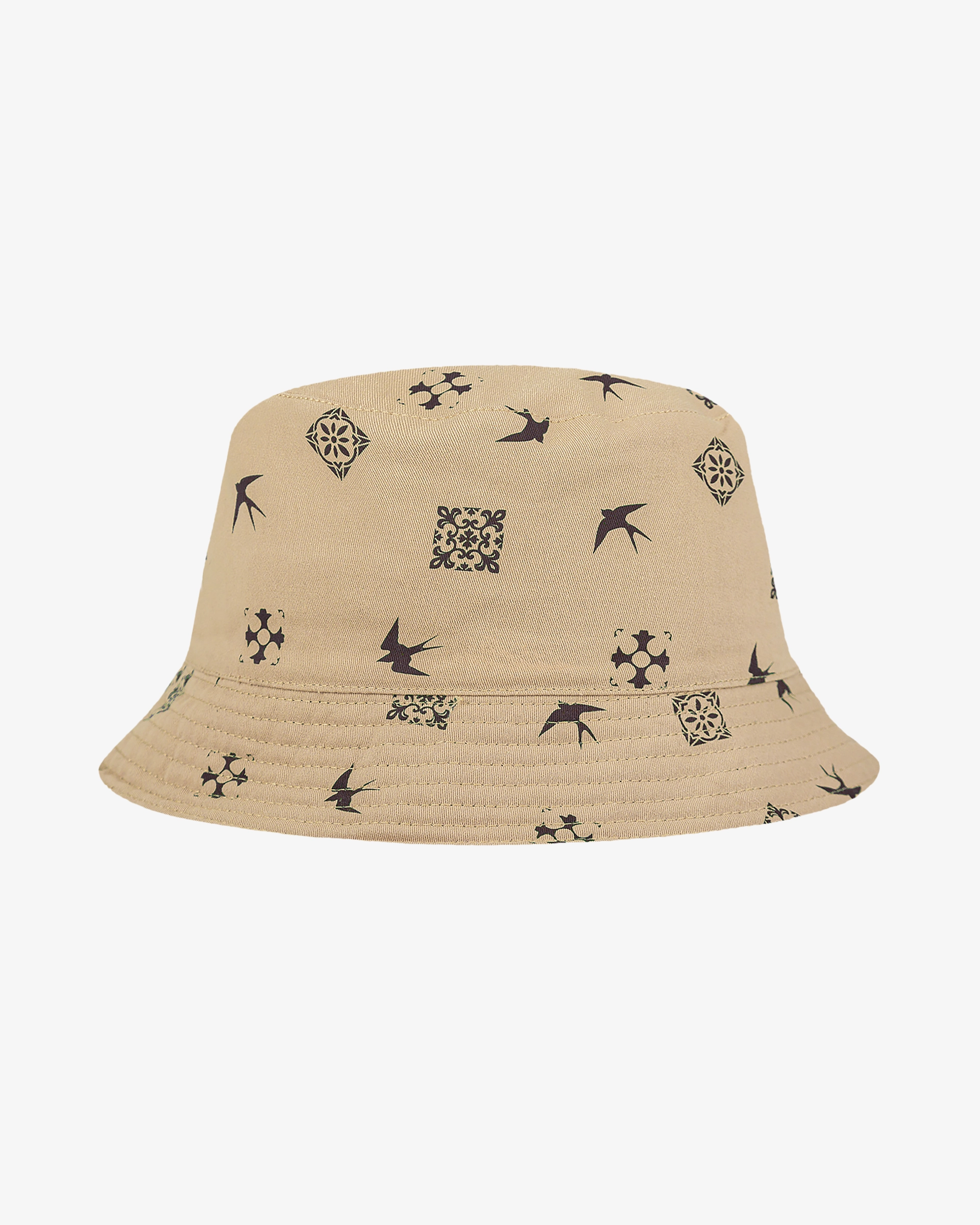 Made from durable 100% cotton twill for breathability and comfort
Brown side features an embroidered Ementa Dots logo and a swallow detail
Reverse side is off-white with a brown pattern inspired by Lisbon’s iconic tiles and swallows
Reversible design for versatile styling options
Classic bucket hat silhouette for a timeless look
One size fits all