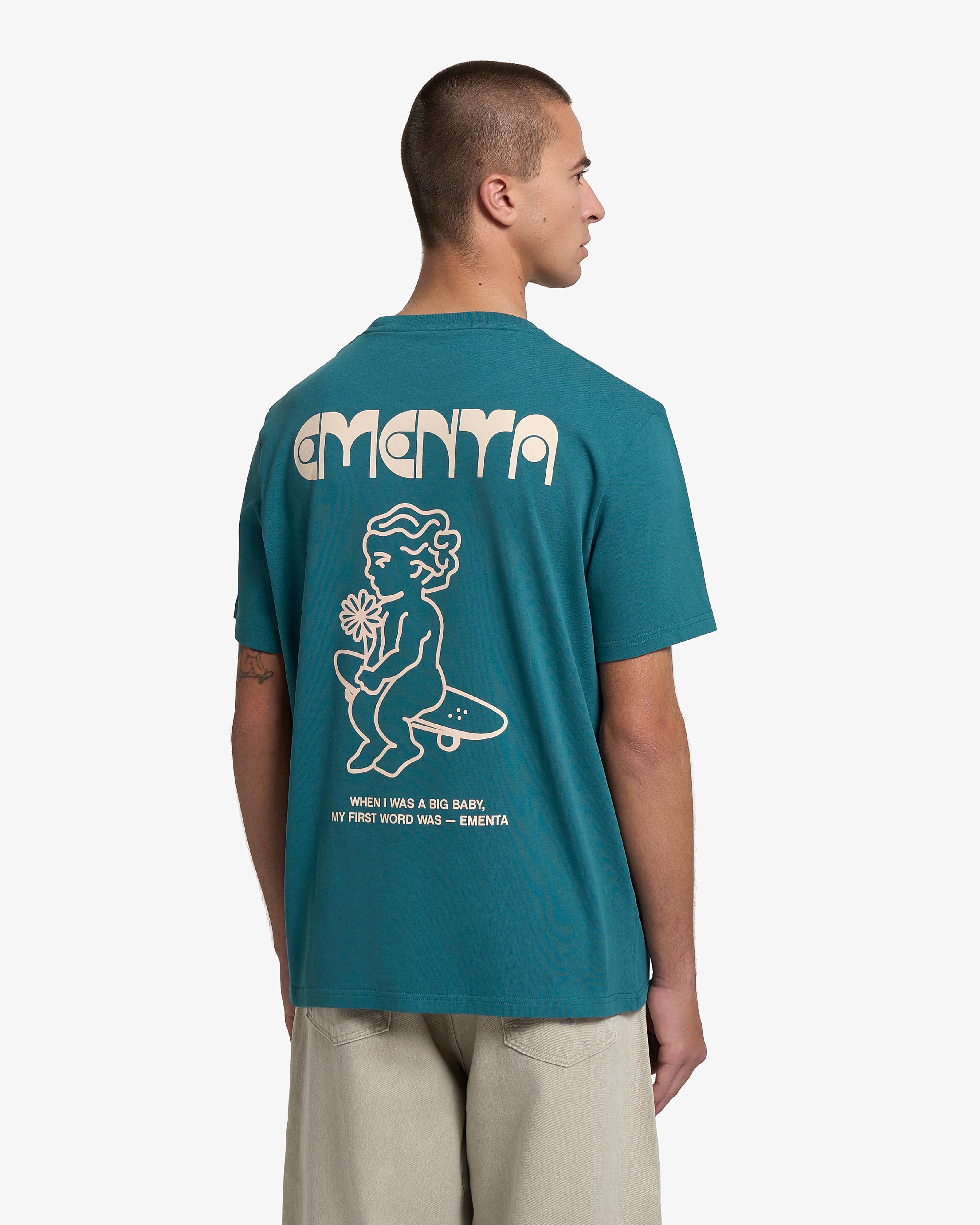 100% cotton, 240 g/m²
Soft feel with a structured shape
Petrol color with off-white "First Word" print
Pre-shrunk to hold its shape after washing
Reinforced collar and double-stitched hems for durability
Unisex fit
Made in Portugal