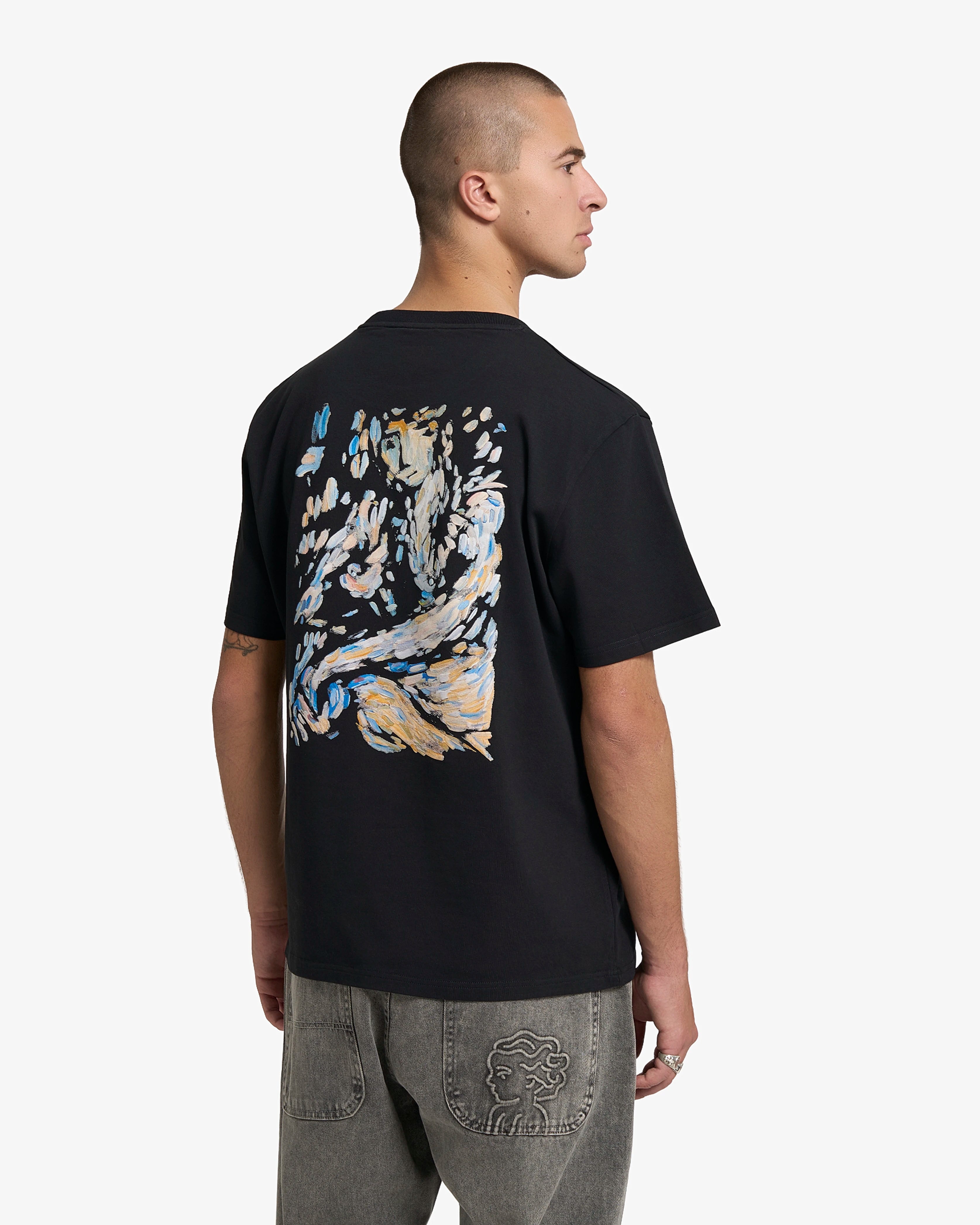 Short-sleeve t-shirt designed for everyday wear
100% cotton fabric with a soft and breathable feel
Regular fit with a straight silhouette
Front chest logo and large back graphic based on an original canvas painting
Black base with multicoloured artistic print
Machine wash cold
Made in Portugal 