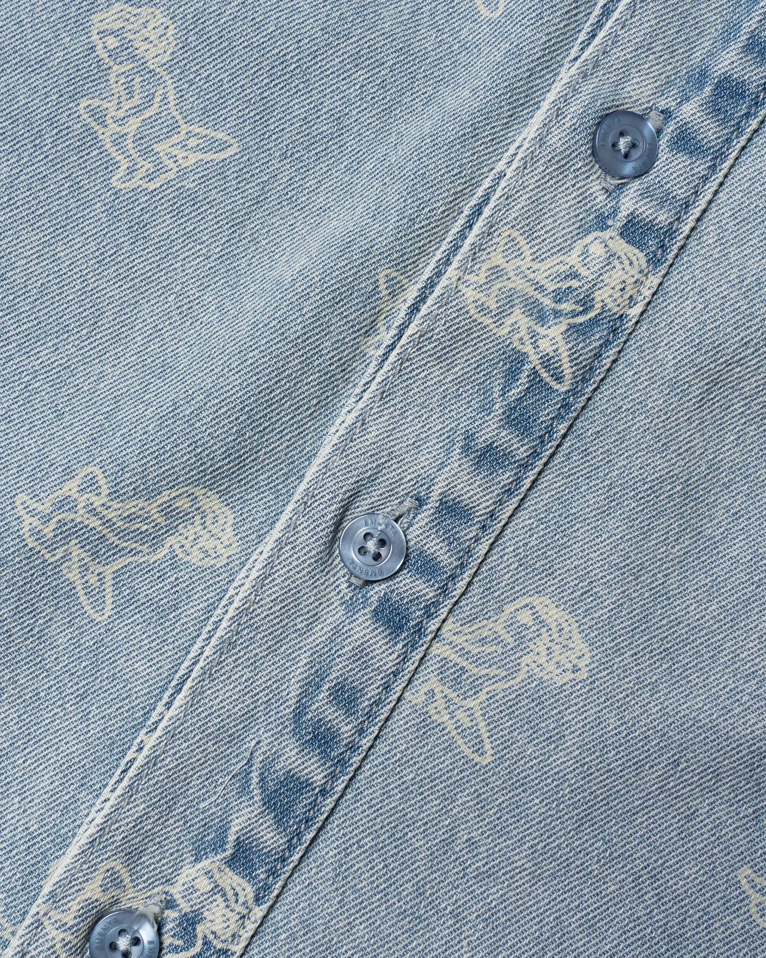 Light blue denim with all-over Ikon logo
Made from 100% cotton for a soft, breathable feel
Short-sleeved construction with a single chest pocket
Button front closure with tonal stitching
Slightly dropped shoulders for a relaxed silhouette
Unisex design&nbsp;
Cold wash only