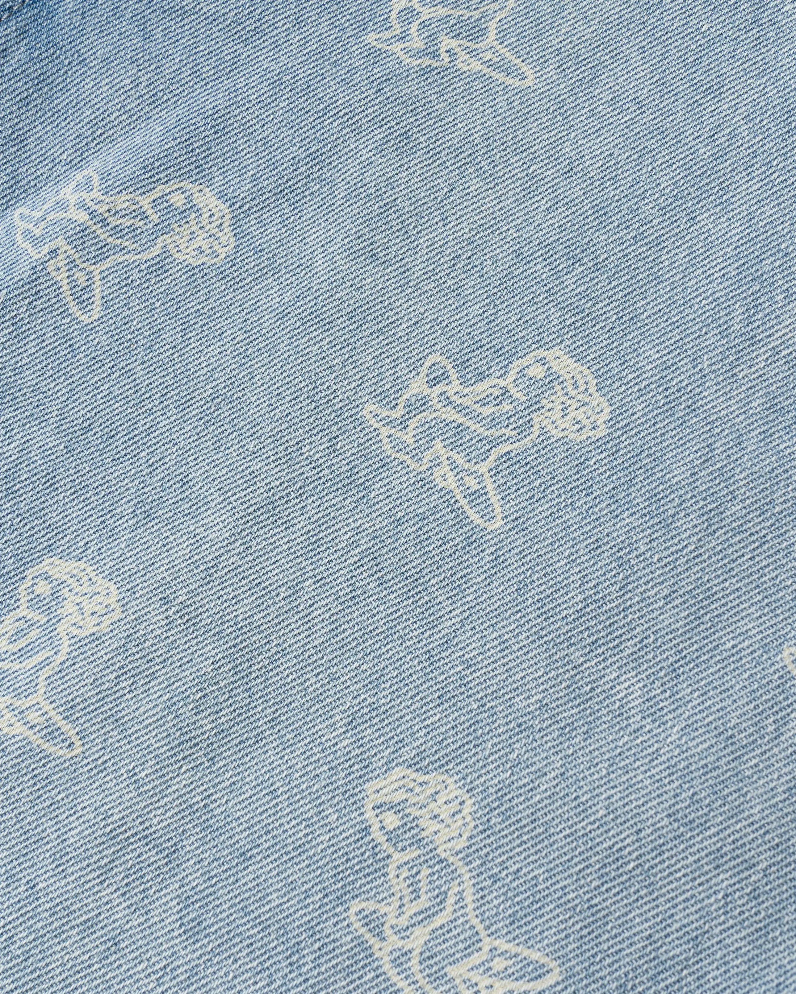 Light blue denim with all-over Ikon logo
Made from 100% cotton for a soft, breathable feel
Short-sleeved construction with a single chest pocket
Button front closure with tonal stitching
Slightly dropped shoulders for a relaxed silhouette
Unisex design&nbsp;
Cold wash only