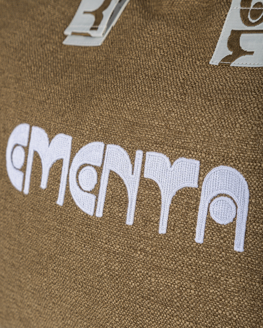 A practical companion for short trips or everyday use. Made from soft, breathable linen in a warm camel tone, this bag combines functionality with elegance. The 'dots' ementa logo is subtly placed on the front and straps, adding a unique touch. It features adjustable straps for a comfortable fit, a spacious 40L capacity, a small inner pocket for valuables, and an additional exterior pocket on the back for easy access to essentials.

Sized to meet airline cabin dimensions, it’s also a reliable choice for tra