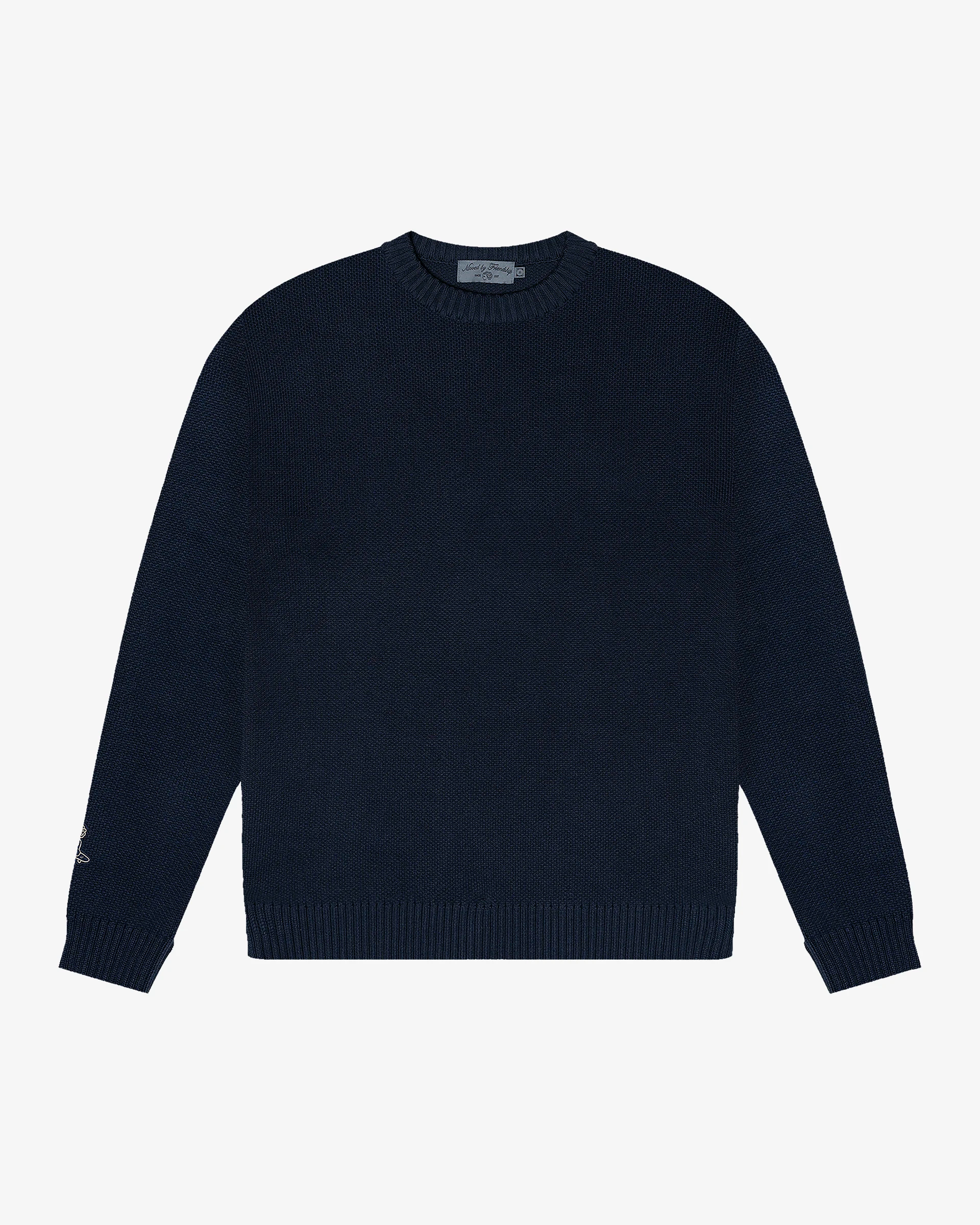 Knitted crewneck sweater designed for everyday wear and layering
100% cotton knit with a structured texture and soft hand feel
Regular fit with ribbed collar, cuffs and hem
‘Moved By Friendship’ motto embroidered across the back
Navy colour
Machine wash cold. Do not tumble dry
Made in Portugal