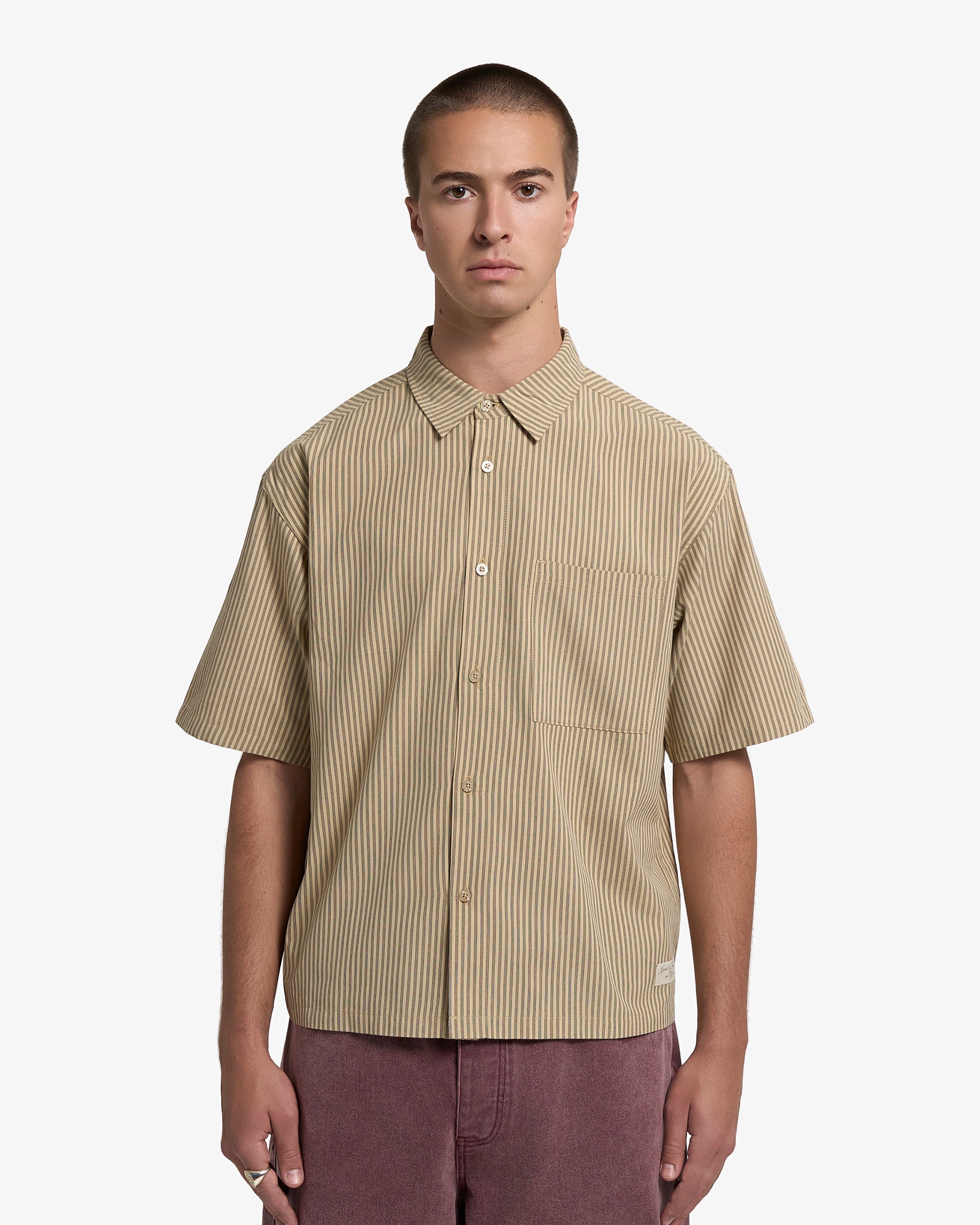 Crafted from soft off-white 100% cotton fabric with a smooth finish for everyday comfort
Features a "Moved by Friendship" tag embroidered&nbsp;
Detailed with tonal stitching and minimalist design elements for a clean look
Styled with a regular fit that works well for casual and smart-casual occasions

Sand colorway offers easy coordination with various wardrobe pieces
Designed as a versatile layering piece suitable for year-round wear