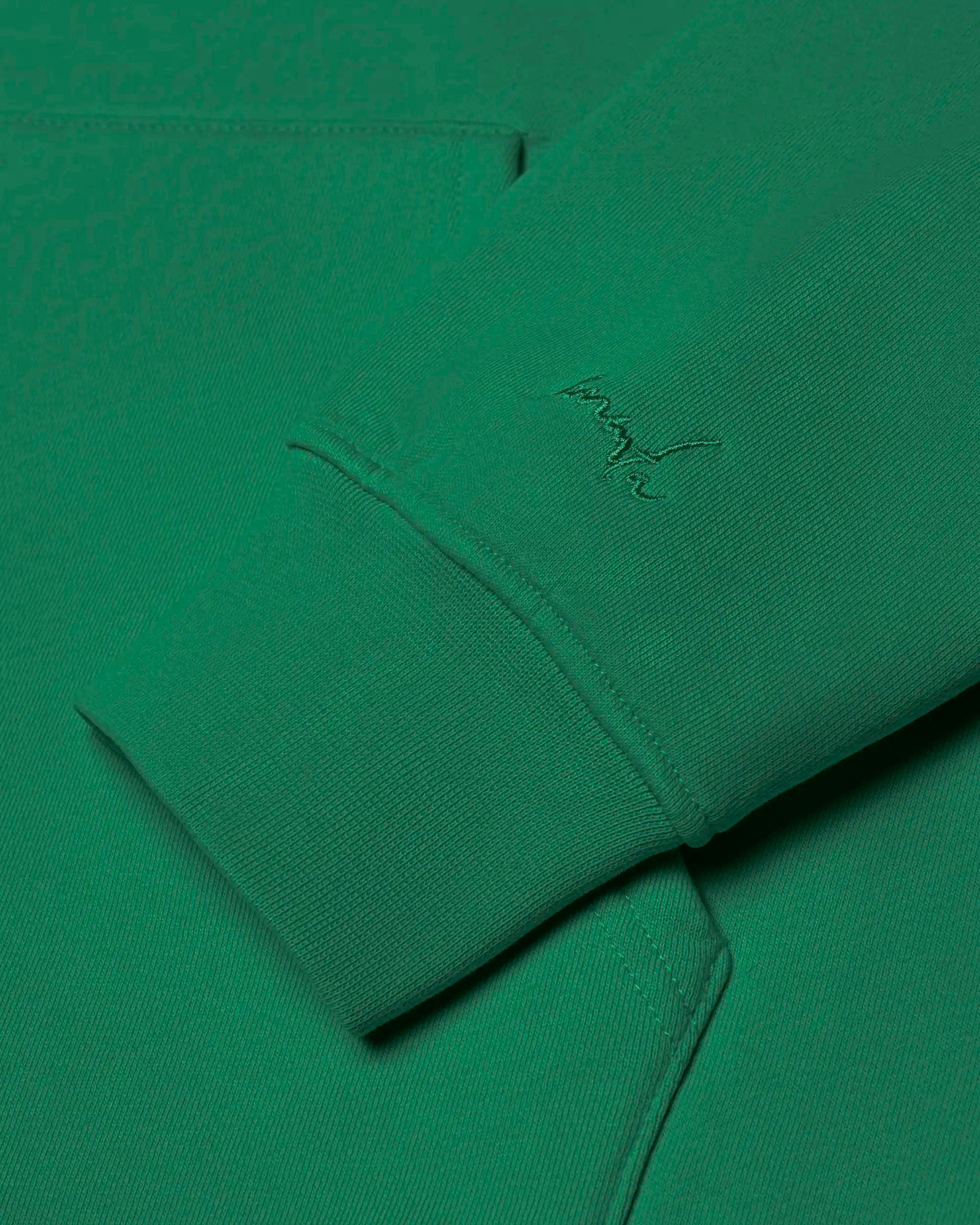 100% cotton (480 gsm) with brushed fleece interior
Evergreen&nbsp; color with an embossed textured Ikon stamp on the back
Subtle signature embroidery on the right wrist
Ribbed cuffs and hem for secure, comfortable fit
Classic kangaroo pocket for easy storage
Zip-less design with a clean pullover silhouette
Made in Portugal&nbsp;
Unisex fit